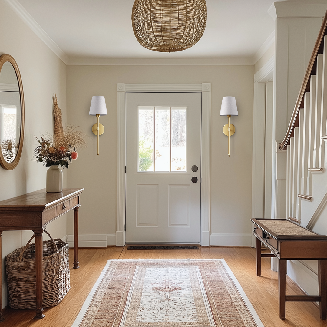 Wall sconces in an entry hall
