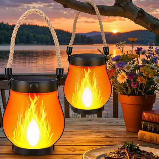 solar flame lantern hanging on tree branch with dancing orange flame effect